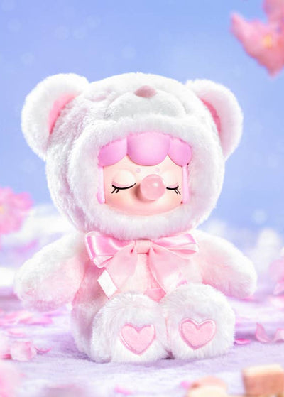 Cute plush toy with pink hair and heart details against a soft purple background with cherry blossoms.
